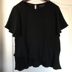 Black top with peplum detail